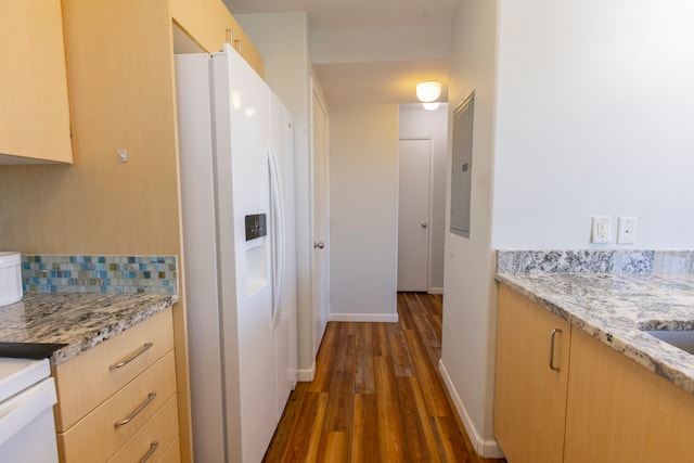 kitchen with white fridge with ice dispenser, electric panel, light stone counters, dark wood-type flooring, and light brown cabinets