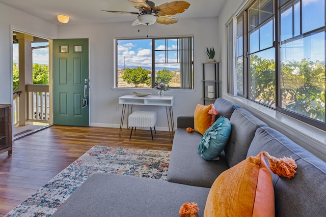 interior space with ceiling fan and hardwood / wood-style flooring