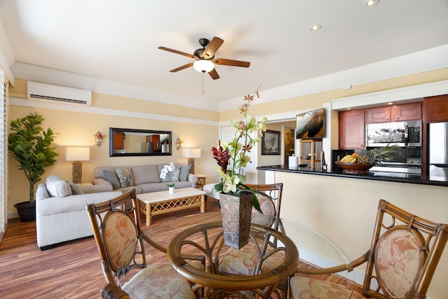 dining area with dark wood-type flooring, ceiling fan, and a wall unit AC