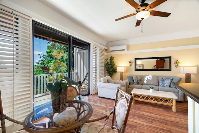 living room featuring hardwood / wood-style flooring, an AC wall unit, and ceiling fan