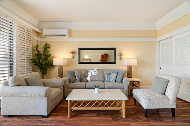 living room featuring a wall unit AC and dark hardwood / wood-style floors