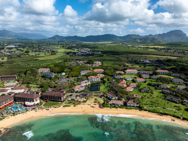 aerial view with a view of the beach and a water and mountain view