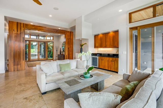 living room featuring ceiling fan and wine cooler