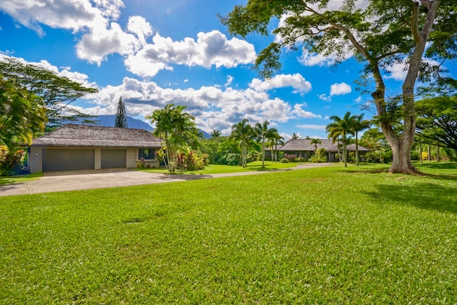 view of yard with a garage