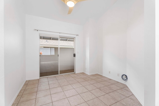 tiled empty room with ceiling fan