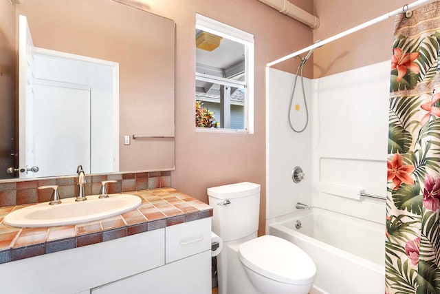 full bathroom with vanity, toilet, and shower / bath combination with curtain