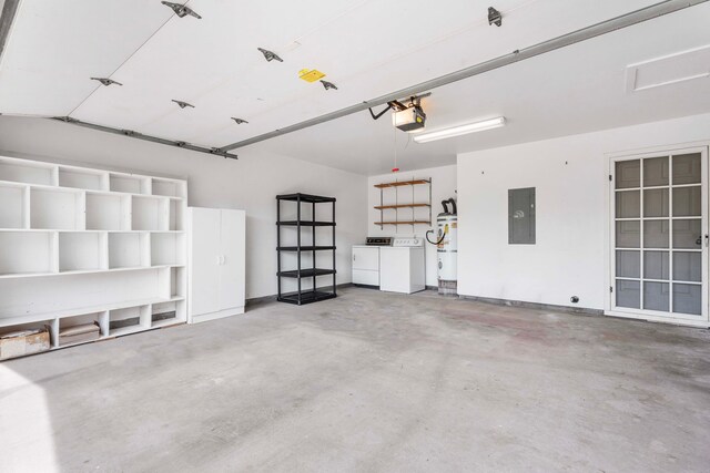 garage with a garage door opener, independent washer and dryer, and electric panel