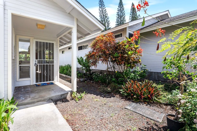 doorway to property with a garage