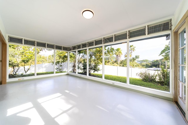 unfurnished sunroom featuring plenty of natural light