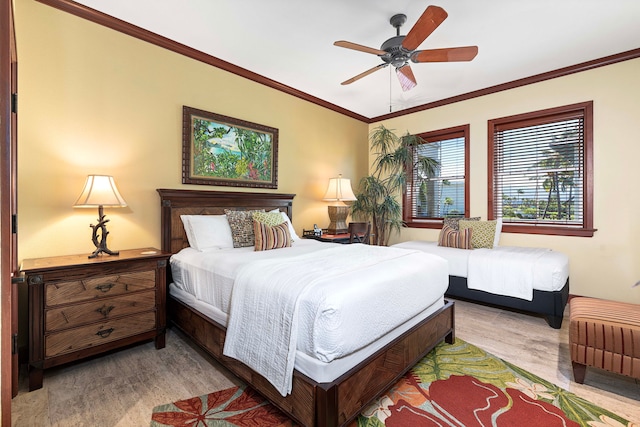 bedroom featuring ceiling fan, wood-type flooring, and ornamental molding