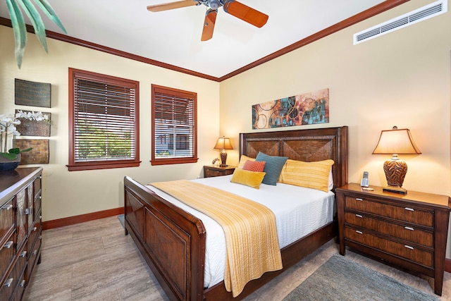 bedroom with baseboards, visible vents, ceiling fan, and crown molding