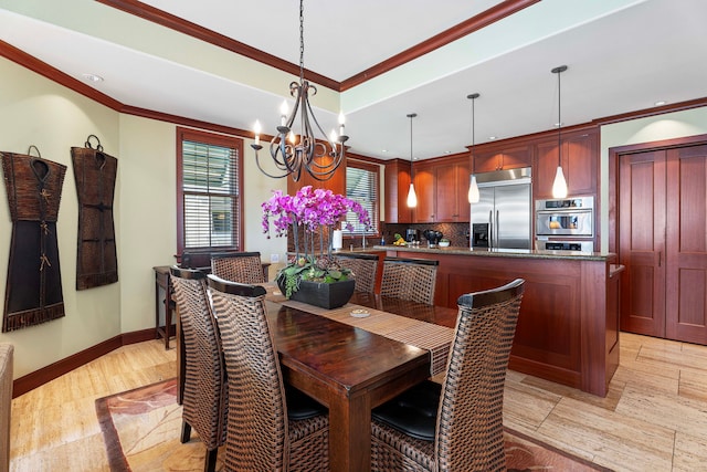 dining space with crown molding, light hardwood / wood-style flooring, sink, and a notable chandelier