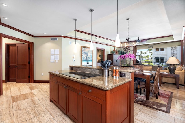 kitchen with a chandelier, black electric cooktop, baseboards, a center island, and crown molding