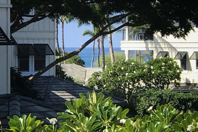 view of side of property with a water view and board and batten siding