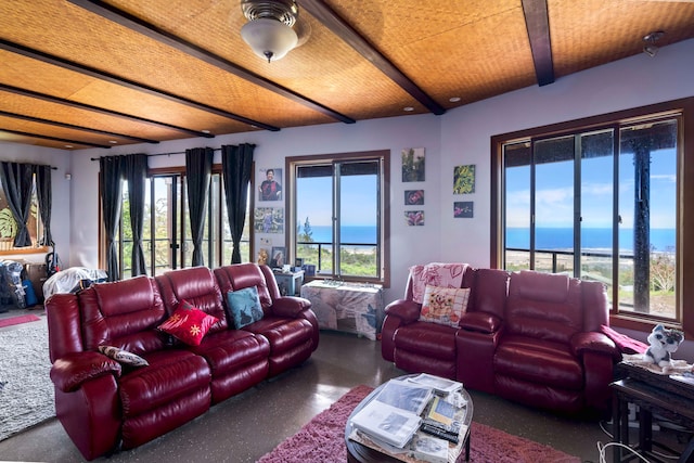 living room featuring a water view and a wealth of natural light