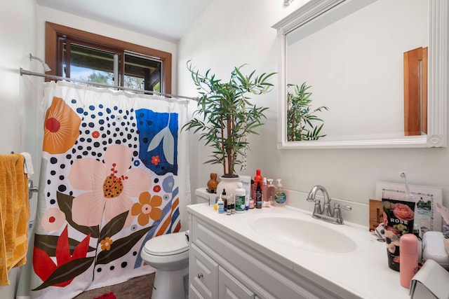 bathroom featuring vaulted ceiling, toilet, walk in shower, and vanity