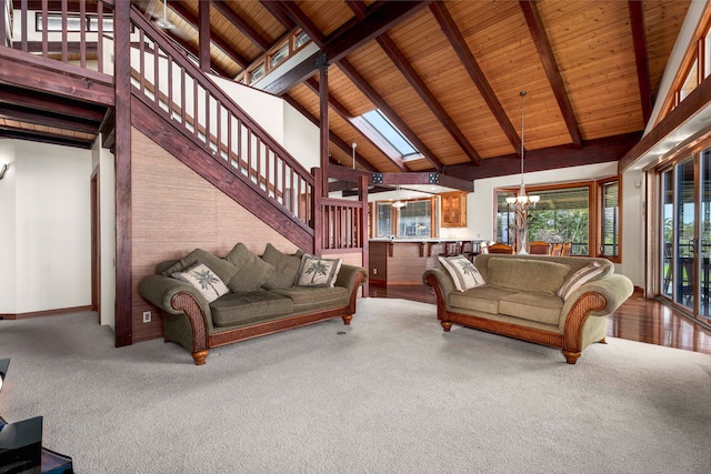 carpeted living room featuring wooden ceiling, beamed ceiling, high vaulted ceiling, and a chandelier