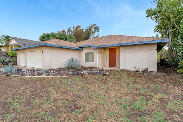 ranch-style house featuring a garage