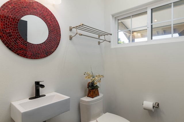 bathroom with toilet and sink