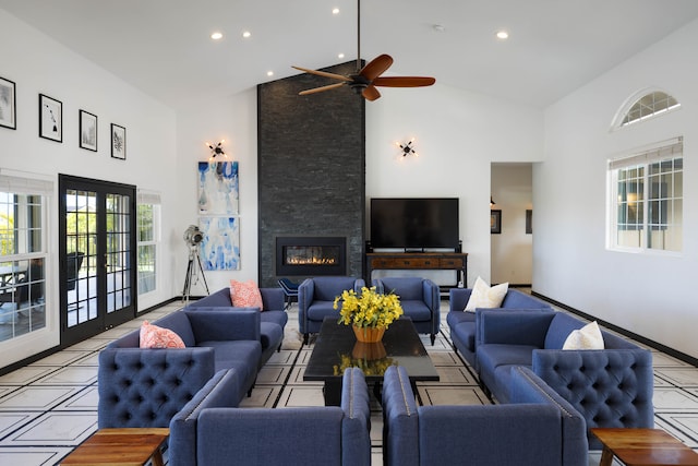 living room with a fireplace, high vaulted ceiling, and ceiling fan