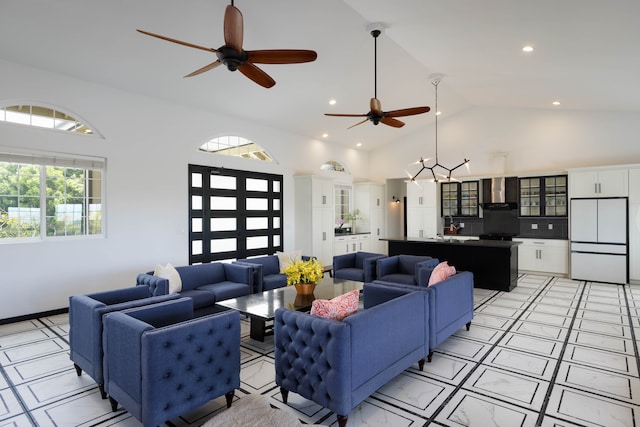 living room featuring high vaulted ceiling and ceiling fan