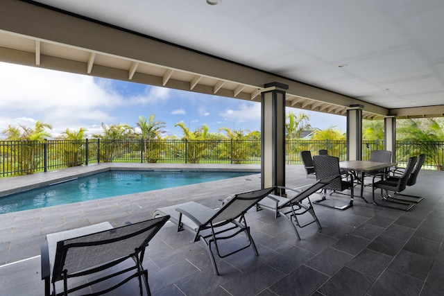 view of swimming pool featuring a patio area