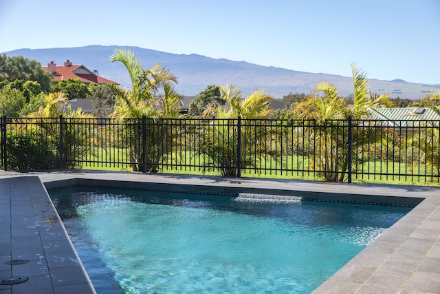 view of pool with a mountain view