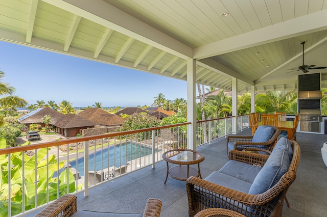 view of patio with a fenced in pool and ceiling fan