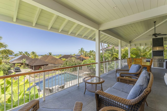 view of patio featuring a balcony and a ceiling fan