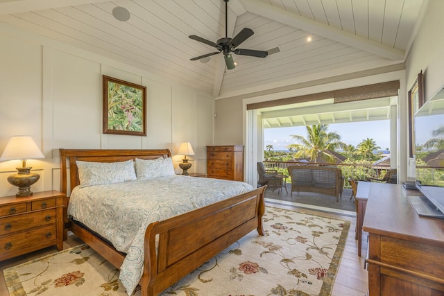 bedroom featuring wooden ceiling, light hardwood / wood-style floors, access to exterior, lofted ceiling with beams, and ceiling fan