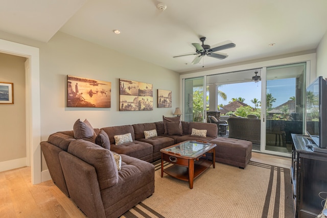 living room with ceiling fan and light hardwood / wood-style floors