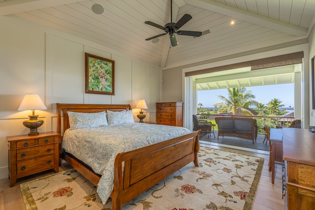 bedroom with wood ceiling, light hardwood / wood-style flooring, ceiling fan, and vaulted ceiling with beams