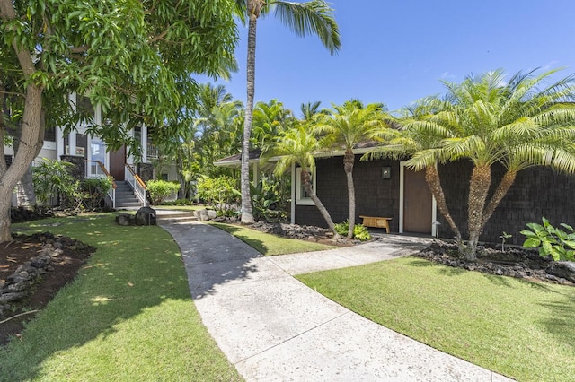 exterior space with a lawn and concrete driveway