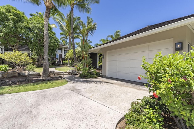 garage featuring driveway