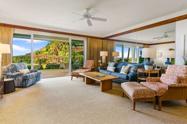 carpeted living room featuring ceiling fan and crown molding