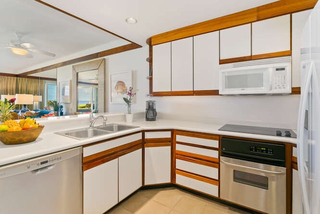 kitchen featuring stainless steel appliances, sink, ceiling fan, and white cabinets