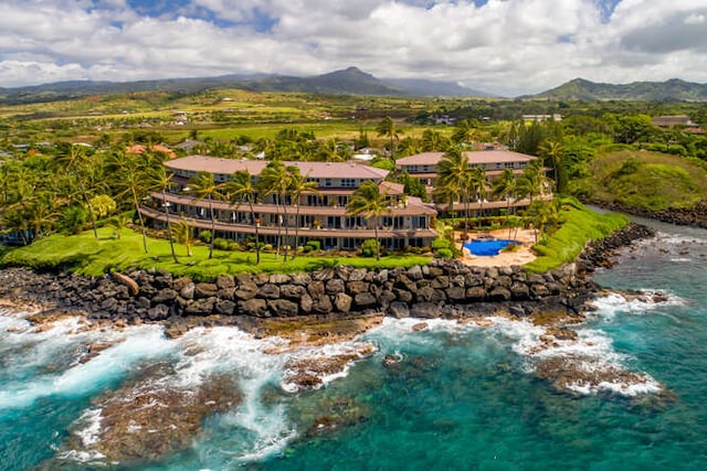 birds eye view of property featuring a water and mountain view