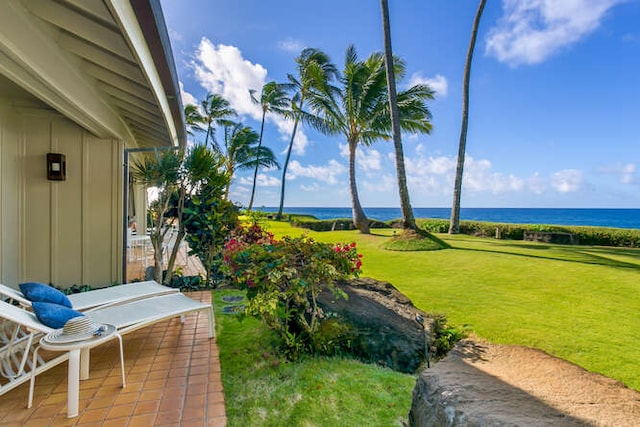 exterior space featuring a water view and a patio area