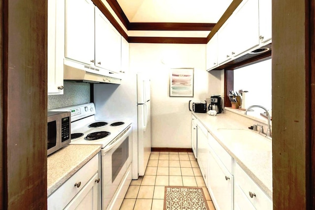 kitchen with white appliances, light tile patterned floors, white cabinetry, and sink