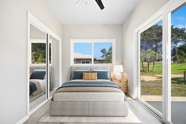 850 Kamalu Rd, Kapaa, HI 96746 - bedroom featuring ceiling fan, wood finished floors, and baseboards