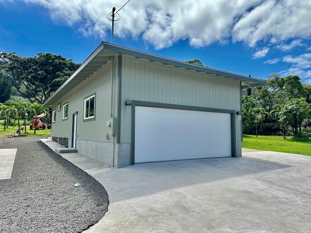 view of side of property with a garage