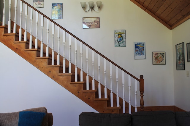 stairs featuring high vaulted ceiling and wooden ceiling