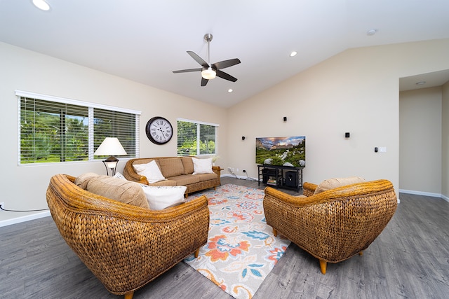 living room with dark wood-type flooring, ceiling fan, and vaulted ceiling