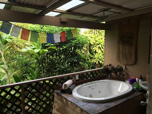 bathroom with tiled bath