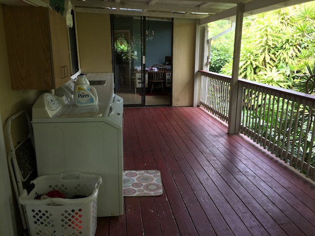 wooden deck featuring washing machine and clothes dryer