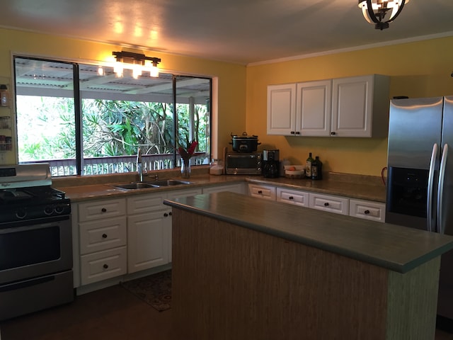 kitchen featuring sink, white cabinetry, stainless steel appliances, and ornamental molding