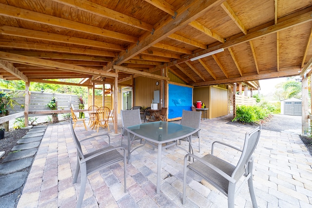 view of patio / terrace with a storage unit