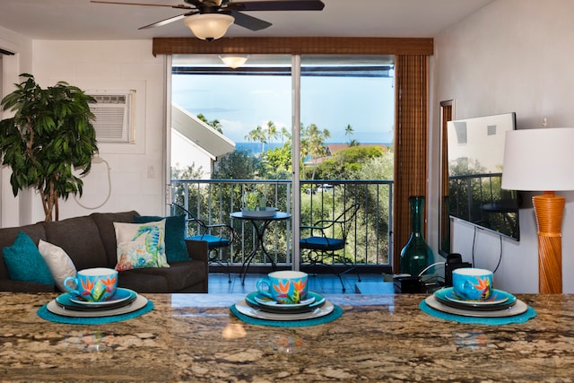 interior space with ceiling fan