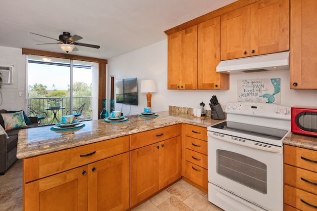 kitchen with light stone counters, kitchen peninsula, ceiling fan, and white electric stove