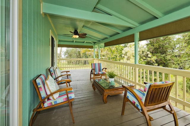 wooden deck featuring a ceiling fan